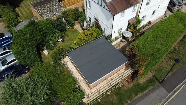 Professional flat roofing work in progress